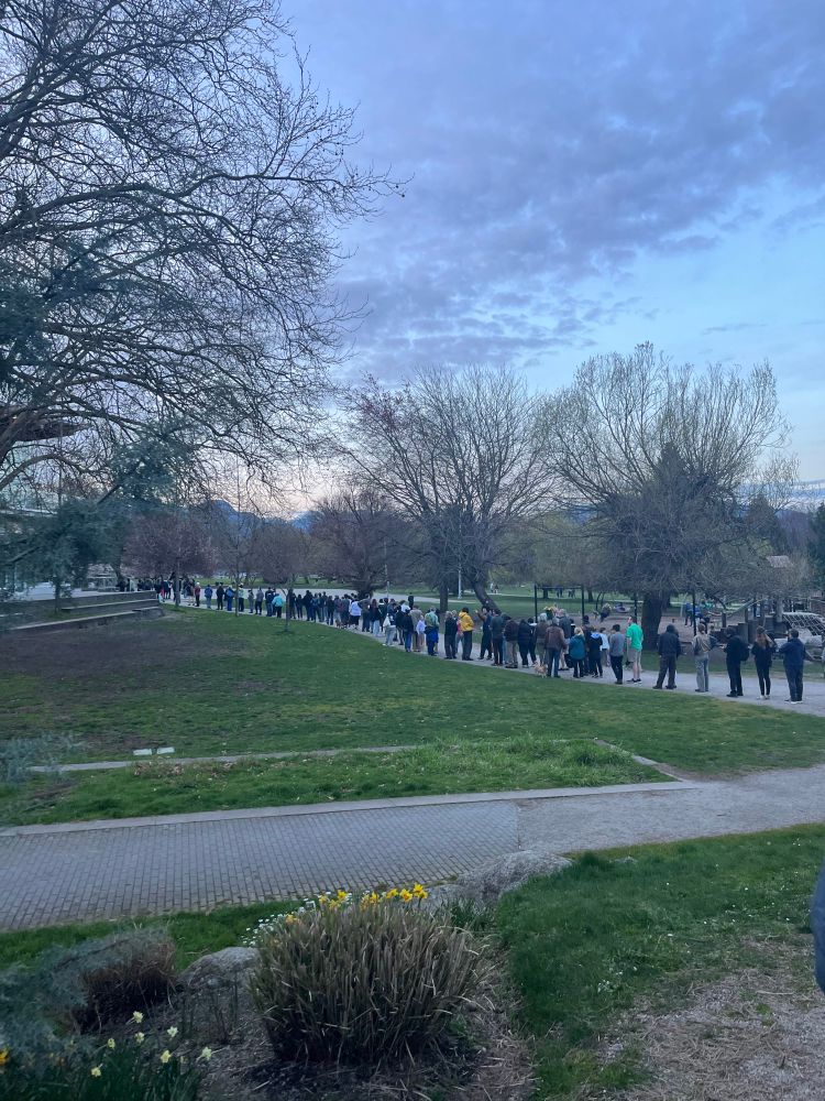A long line of people around Trout Lake Community Centre