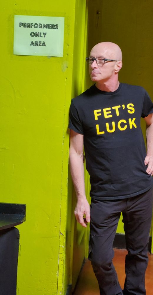 DeCrow wears a shirt that says 