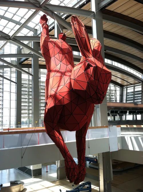 Red rabbit sculpture at Sacramento International Airport consisting of a shockingly small number of polygons
