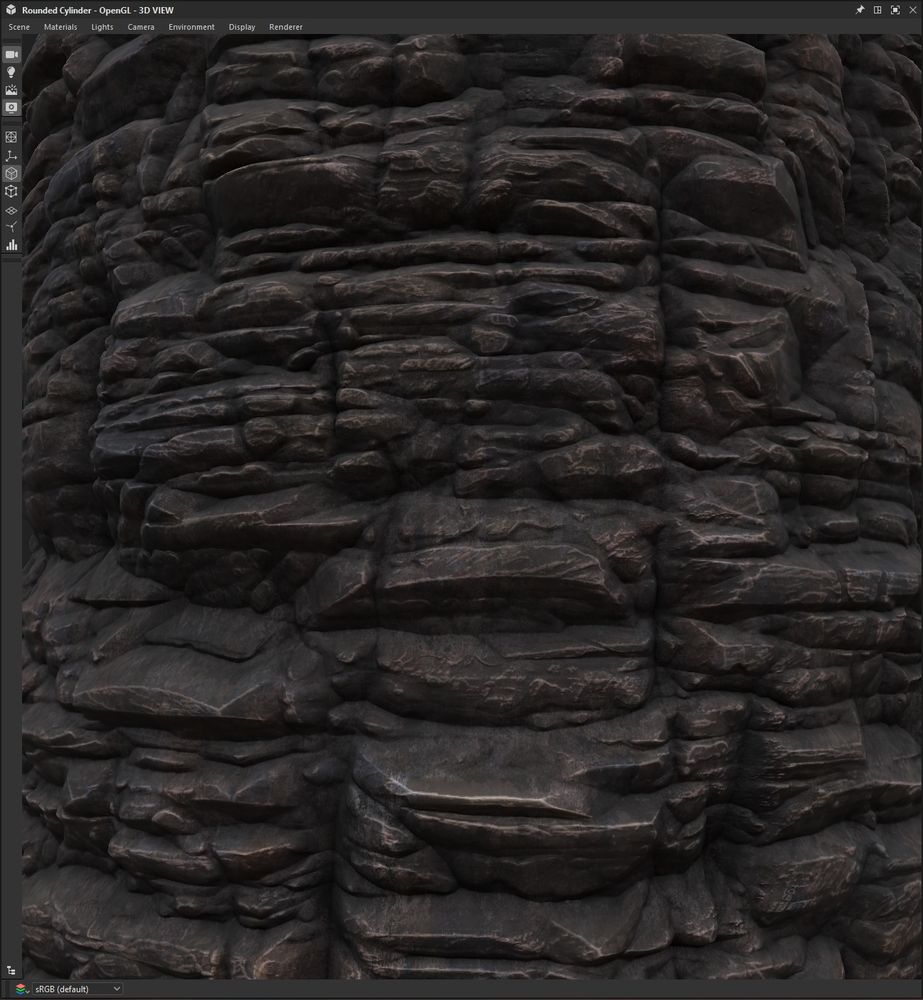 screenshot of a cylinder with the same tiling rock cliff material on it, zoomed closer in. the color of the cliff is black, with hints of brown in the edges