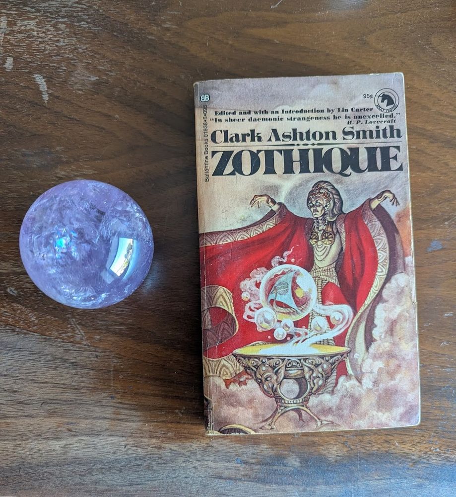 First edition Ballantine Books Zothique by Clark Ashton Smith. Next to an amethyst orb.