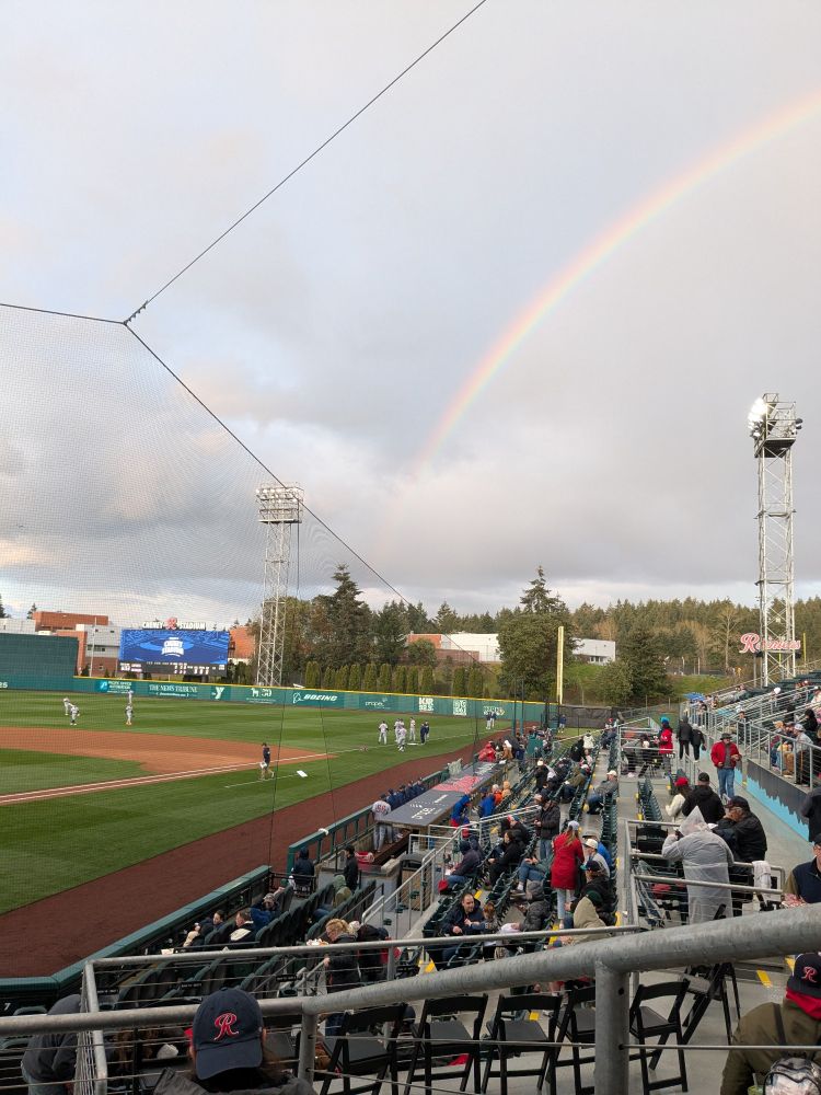 A rainbow shines over the tacoma rainiers field bleachers