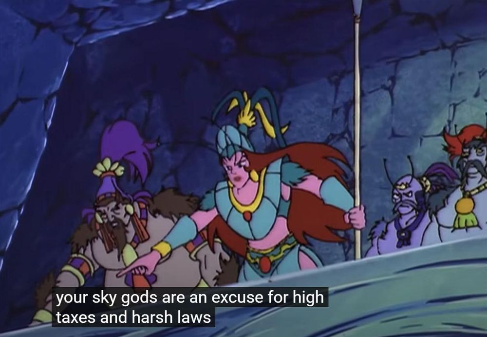 A pink-skinned alien woman with antennae stands in the middle of a group of revolutionaries.  She points downward.  The caption reads:  "Your sky gods are an excuse for high taxes and harsh laws!"