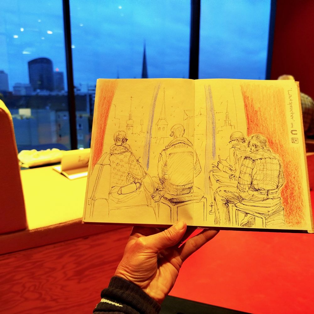 Sketchbook in front of the window. 