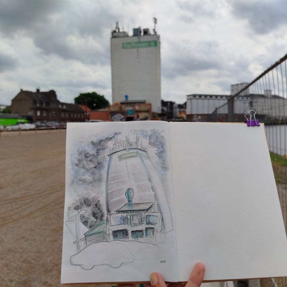 Sketchbook in front of the Raiffeisen tower and some ruins. 