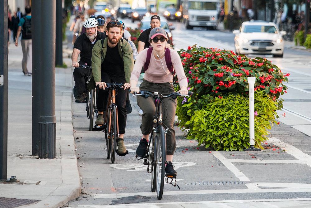Protected bike lane on the left and only a hand full of cars on the "street"

Bike, Urbanism, Walk