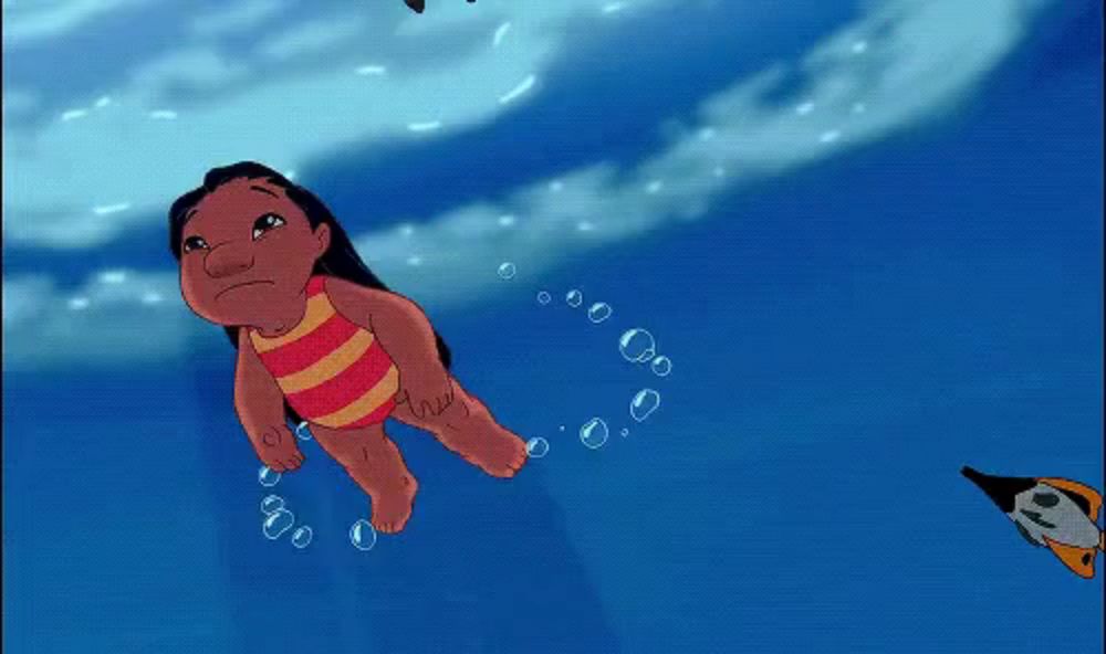 a cartoon character in a red and yellow striped bathing suit is swimming in the water