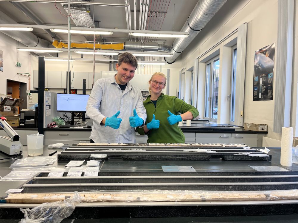 PhD students Gavin (left) and Elo (right) at Bremen Core Repository sampling marine cores