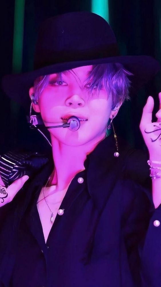 Jimin in a Carmen San Diego hat during filter performance 
