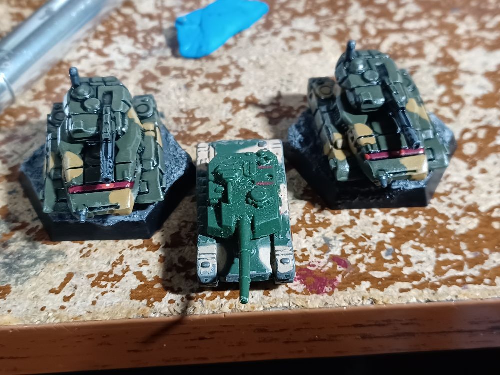 Some more battletech minis painted. Two Vedette tanks 

There color scheme is based on the triax army from the old kenner toyline, Megaforce. Which is also in this picture. Which is a army green and tan with red windows