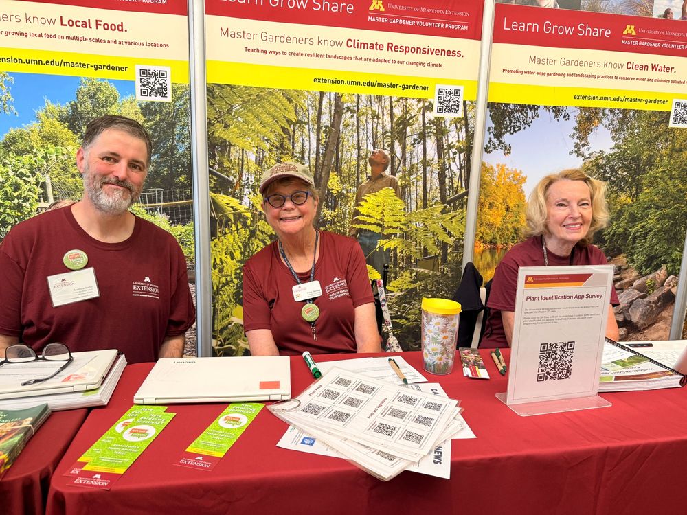 Three Master Gardener volunteers at a booth at the State Fair.
