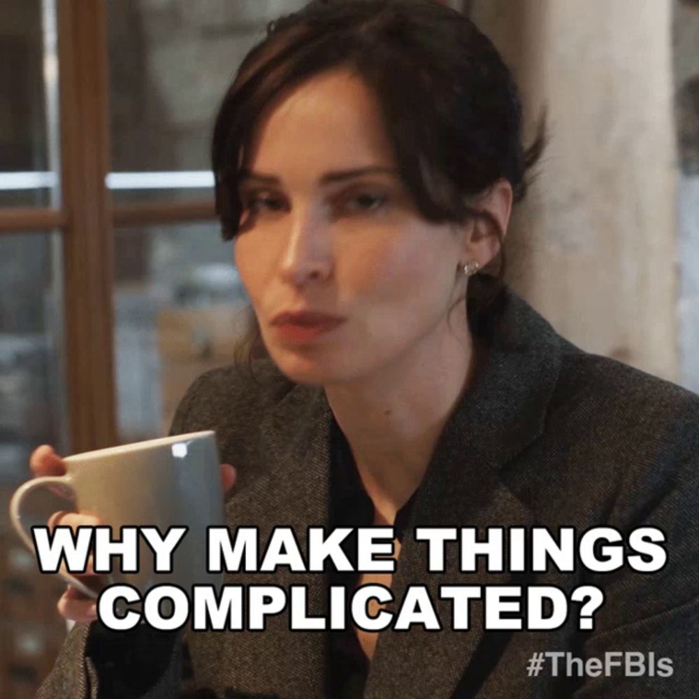 a woman is holding a cup of coffee and asking why make things complicated