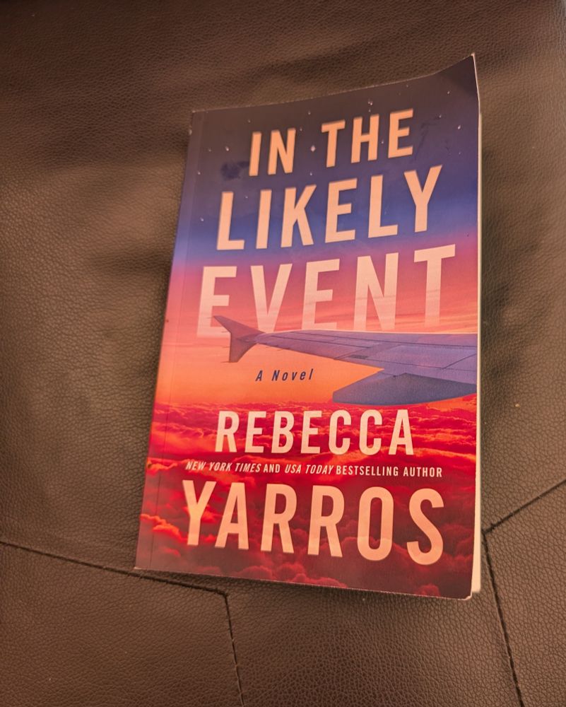 A paperback copy of In The Likely Event by Rebecca Yarros 