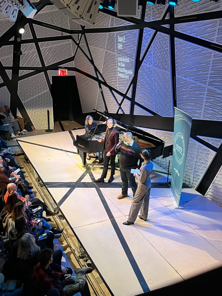 Joshua Bornfield introduces their music before it is performed by Michael Manganiello and Stephanie Baird at songSLAM at National Sawdust in NYC>