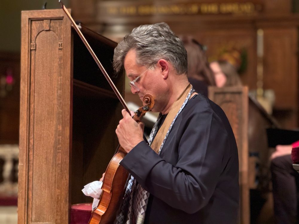 As I give spoken program notes, Peter sits thoughtfully with bow and violin.