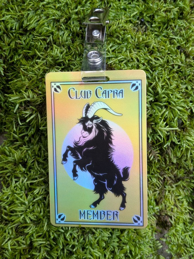 A credit card sized, double sided, plastic badge that features artwork of a rearing goat. It says "Club Capra Member"