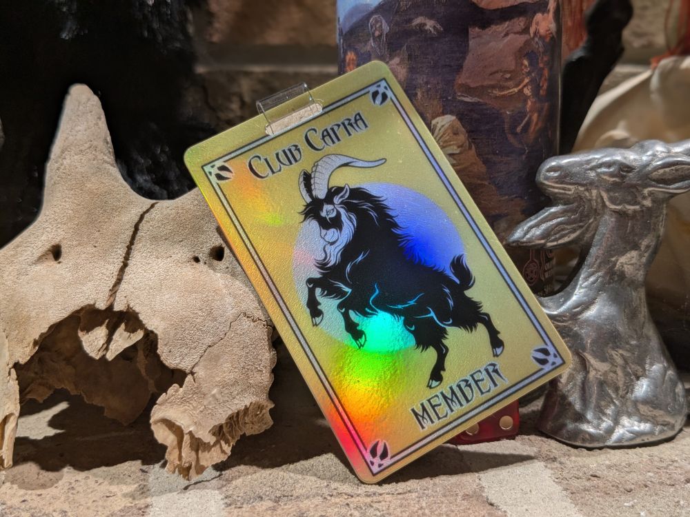 A credit card sized, double sided, plastic badge that features artwork of a rearing goat. It says "Club Capra Member"