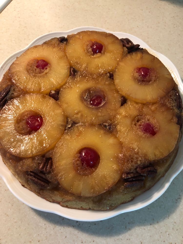 Pineapple upside-down cake with pecans and maraschino cherries