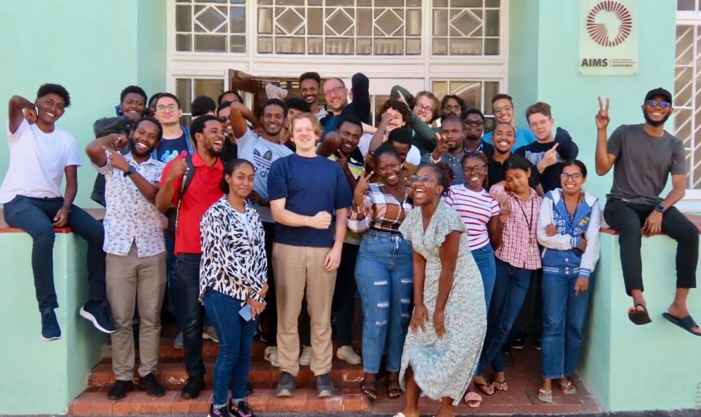 A class photo in front of the AIMS building in Muizenberg, Cape Town.