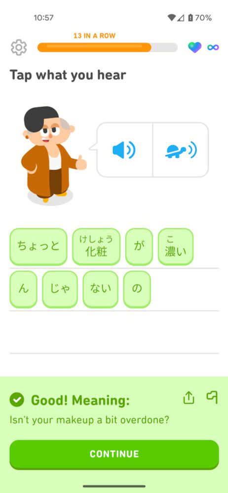 A screenshot of a Japanese listening exercise in Duolingo, and the English translation of the sentence is "Isn't your makeup a bit overdone?"