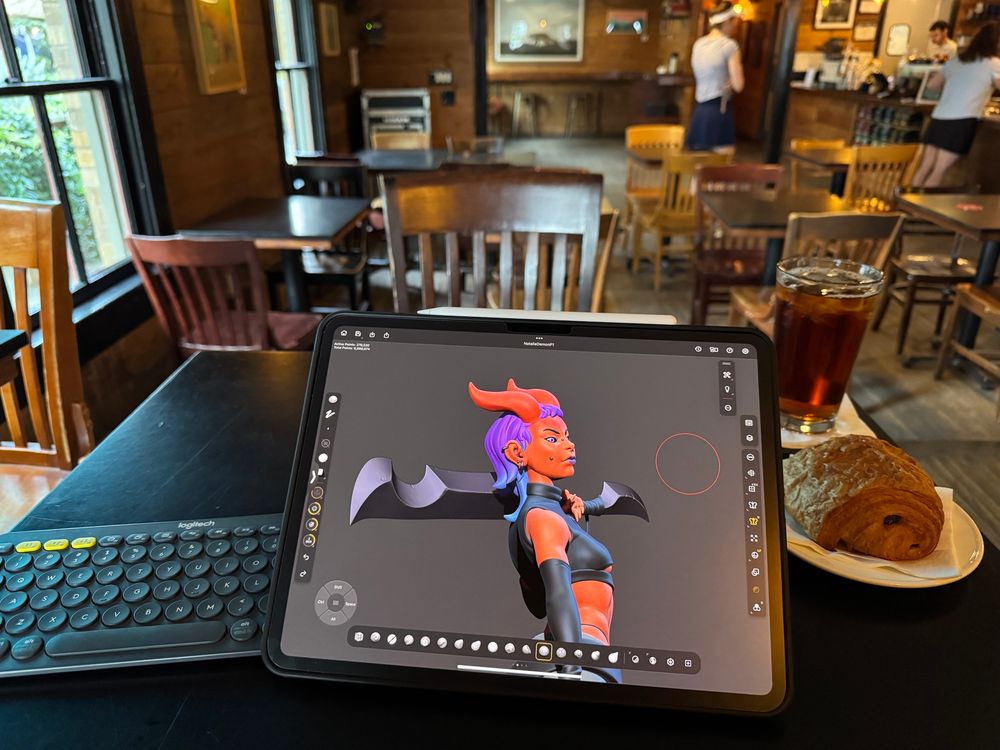 Cafe shot of a red demoness wielding a sword while wearing street clothes with a chocolate pastry