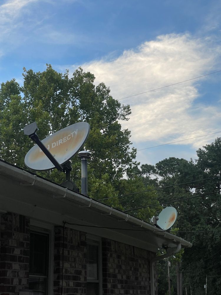 Photos of my roof with two old satellites for when cable was a thing.  