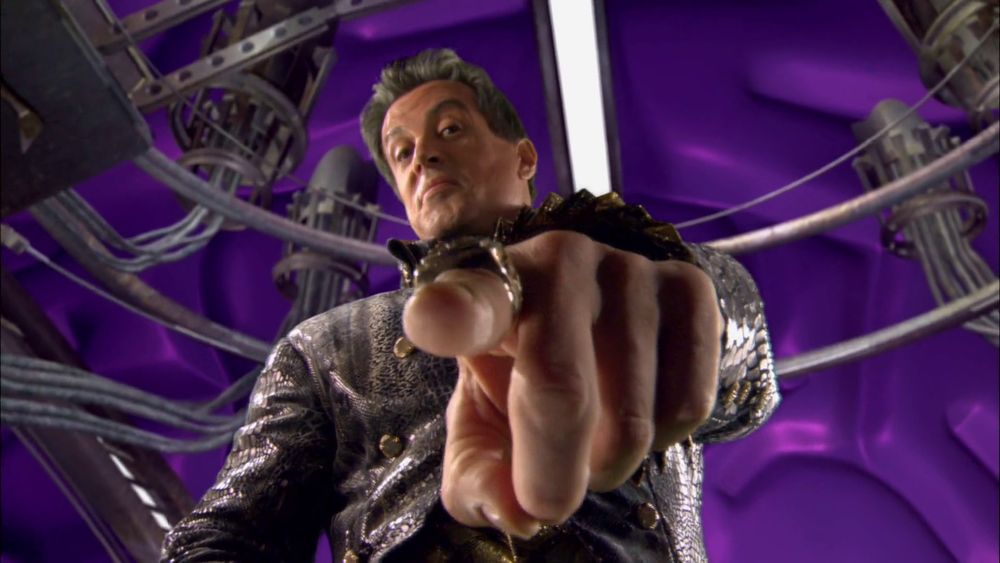 sylvester stallone in spy kids pointing down at you