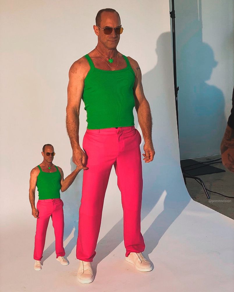 christopher meloni in a photo shoot holding hands with a tiny version of himself 