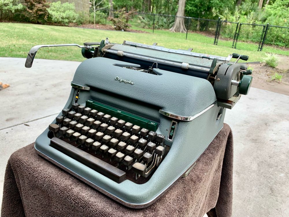 Semi-restored army green Olympia SG1 full sized office typewriter. 