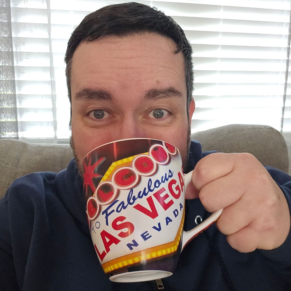 Me, drinking out of a Las Vegas coffee mug.