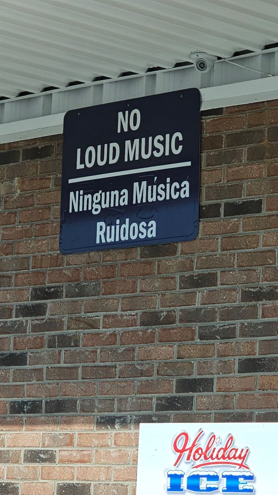 Sign that says no loud music