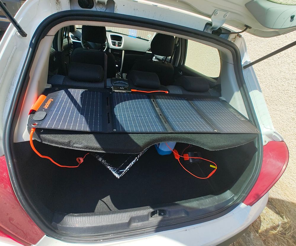 Back of the car, 40 W solar panel on the rear deck, a Jackery power bank, and a G2 station 