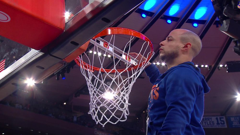 the rim is being check to see if it's level in knicks vs kings