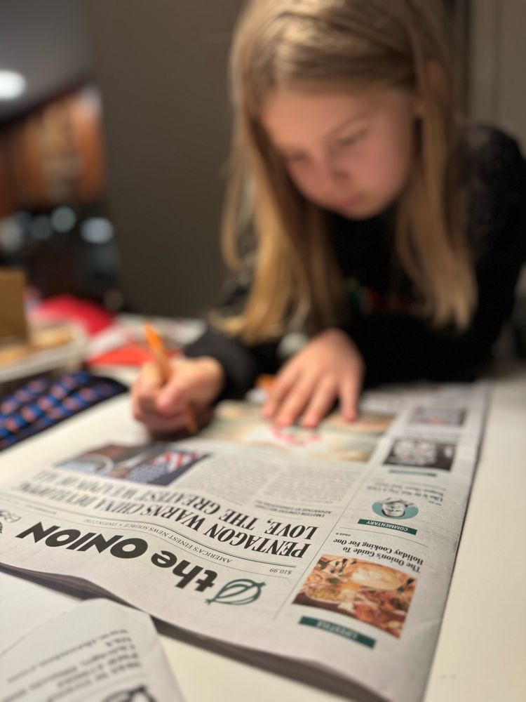 Child reading Uncle Ben’s fake newspaper 