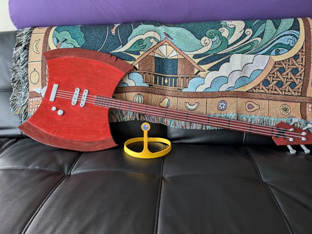 The finished axe with strings and Princess Bubblegum's crown, also made of EVA foam