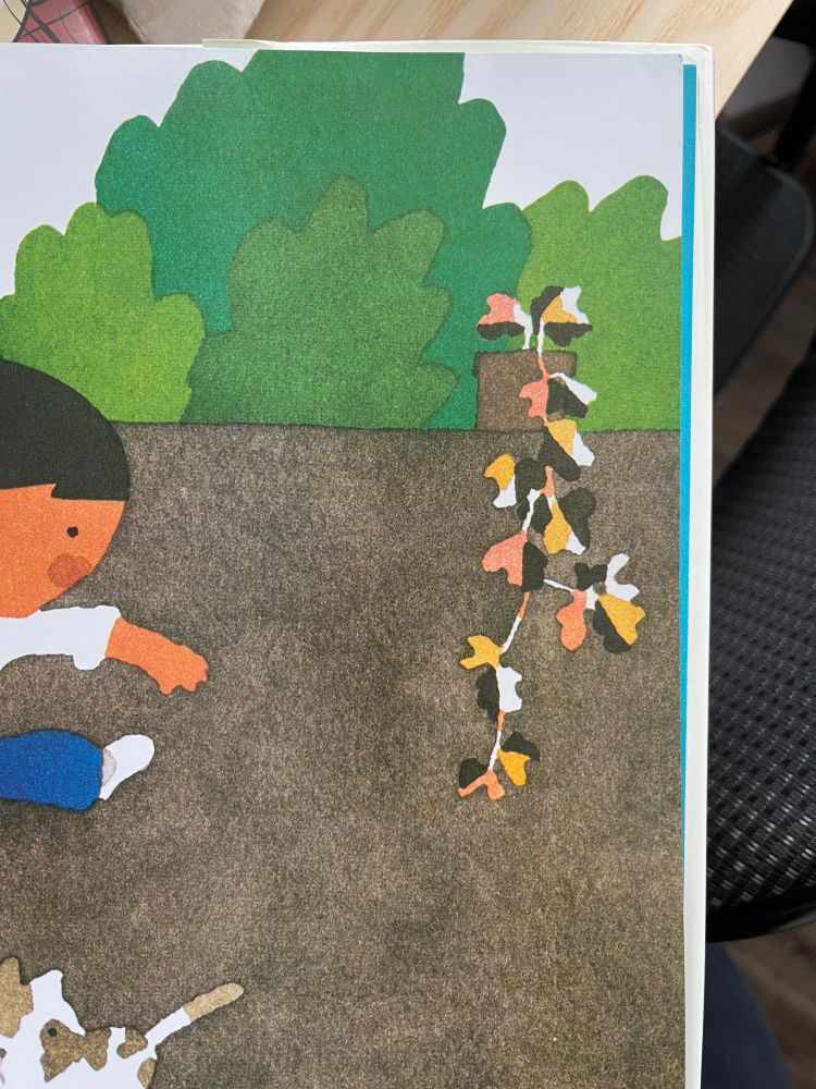 Taro Gomi illustration cropped to feature a plant painted in pink, yellow, black, white