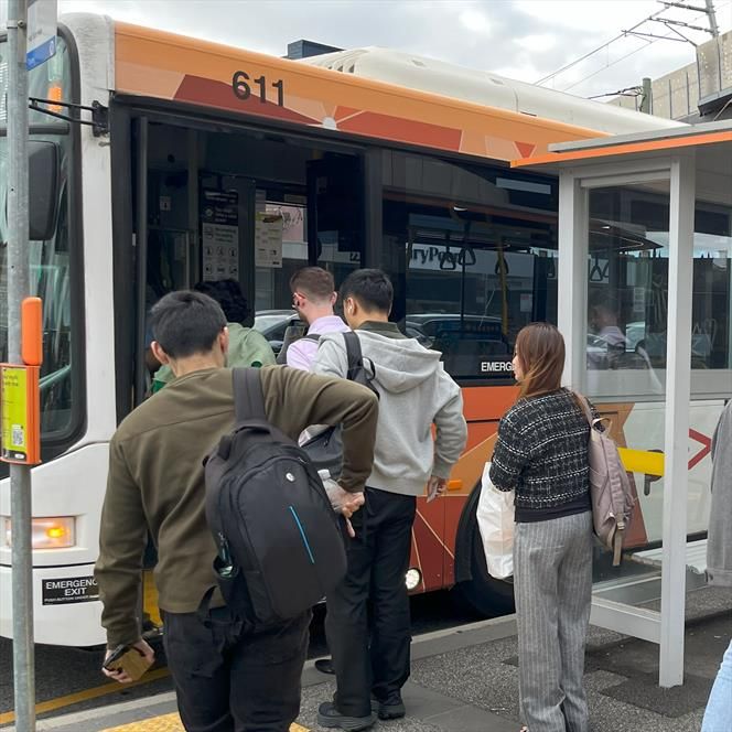 People boarding a bus