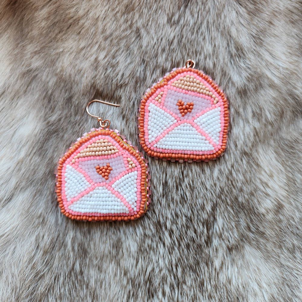 Beaded love letter earrings. A white envelope with a pink paper and dark orange heart. 