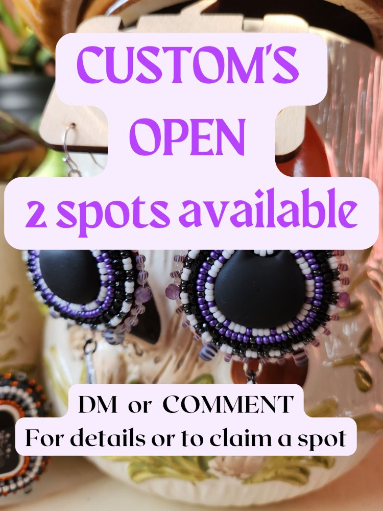 Pictures of a pair of beaded earrings that are purple and black, with a black cat cabachon in the middle. 
Text over top of the image reads. "Customs open, 2 spots available." Below that reads "DM or comment for details or to claim a spot." 