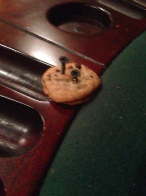 a cookie is screwed into a wooden table