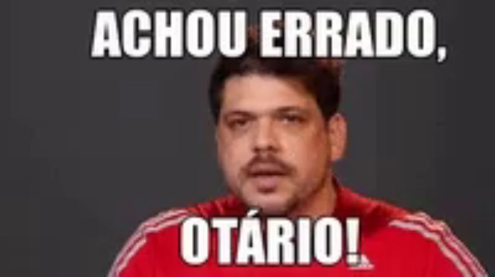 a man in a red shirt with the words achou errado otario written on it .