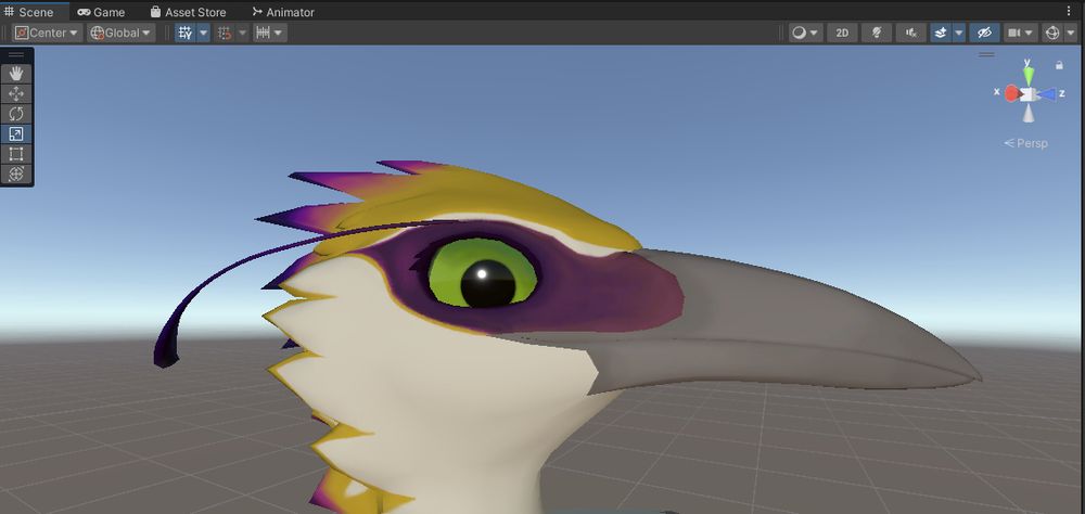 A default unity scene window with various controls surrounds the top of the window with various tools. In the center of the scene view a 3d model of a bird with green eyes along withyellow, white and purple markings.