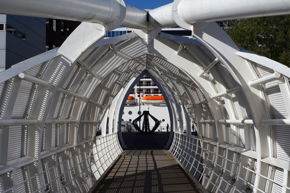 A cruise ship seen through a bridge