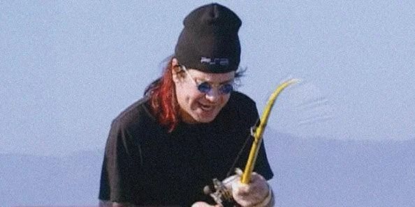 Ozzy Osbourne fishing with a PS2 beanie on. 🤙