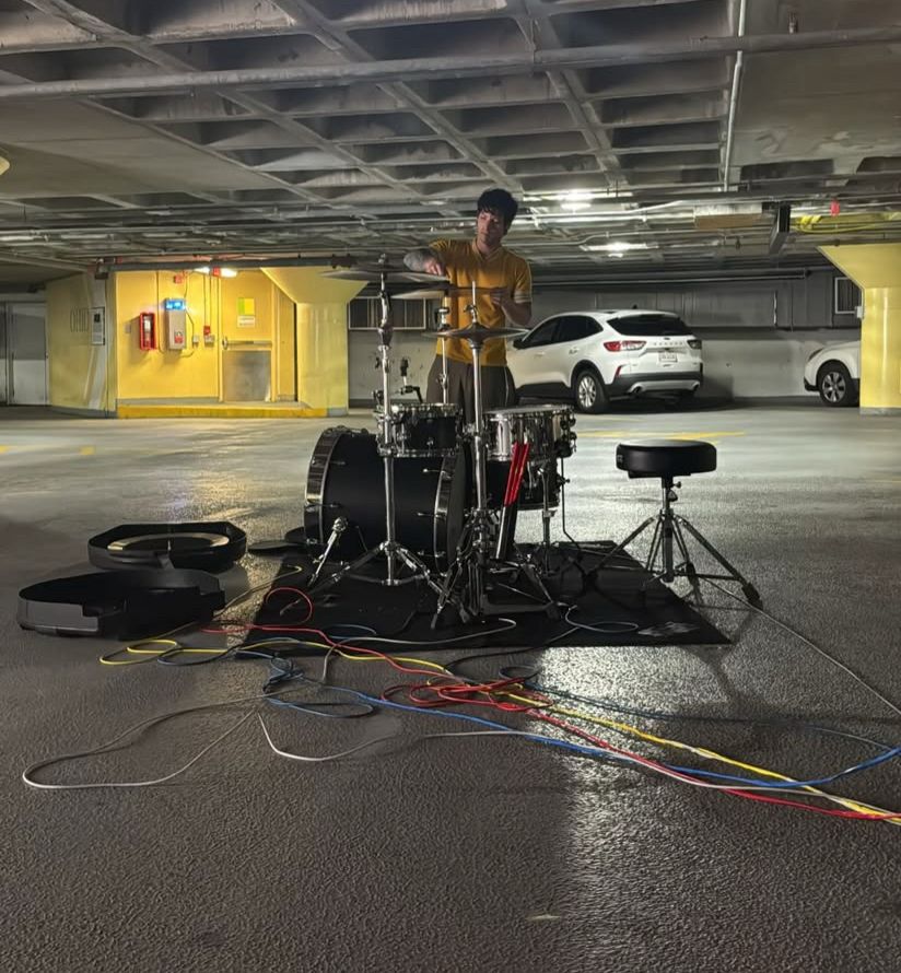 josh dun with a drum set in a garage via tyler joseph's instagram story