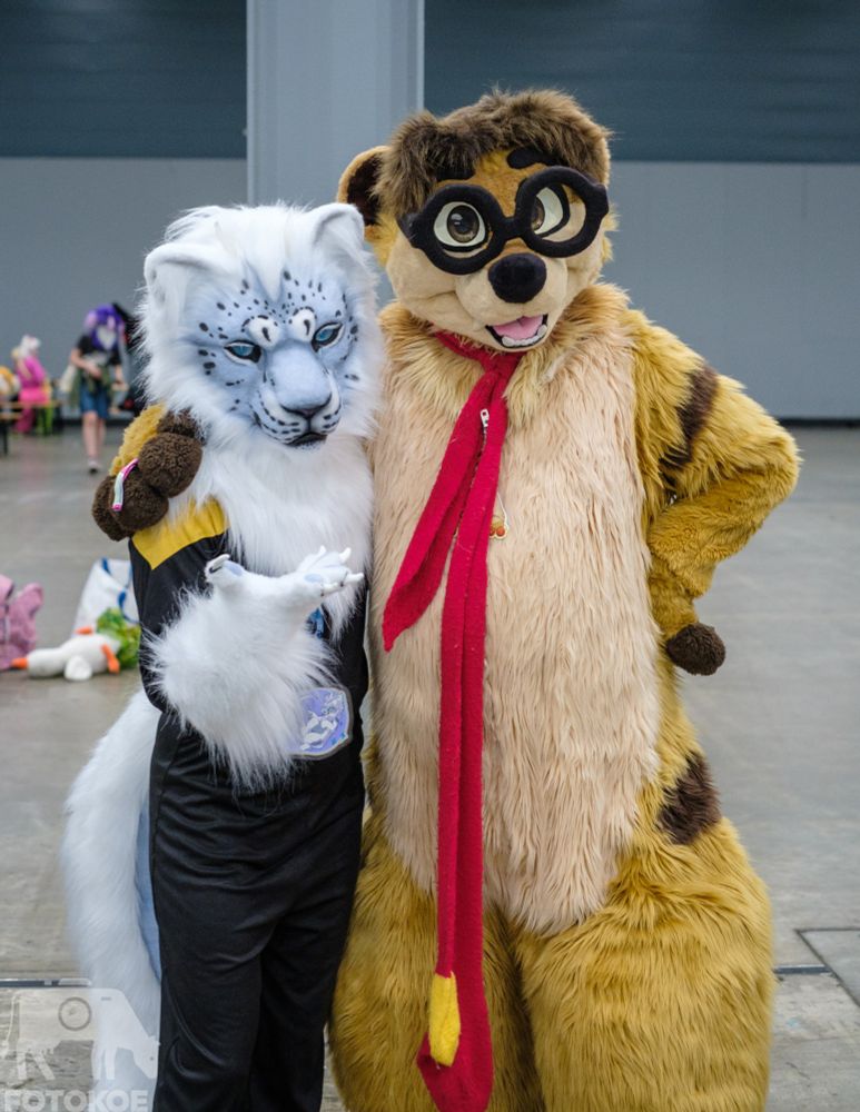 2 fursuiters posing for the camera