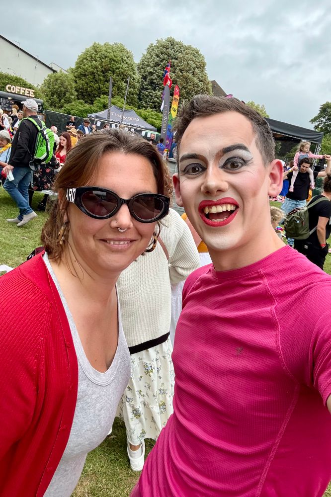 Laura Eccott wearing sunglasses and smiling with Aida H Dee who is wearing a pink t shirt and smiling 