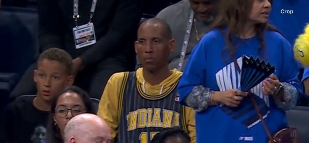Reggie Miller in the stands looking dour