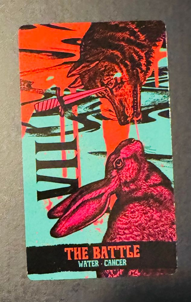 The Battle card shows a drawing of a hare staring down a wolf, which has a dagger through its eye. Card by Cosmic Butcher