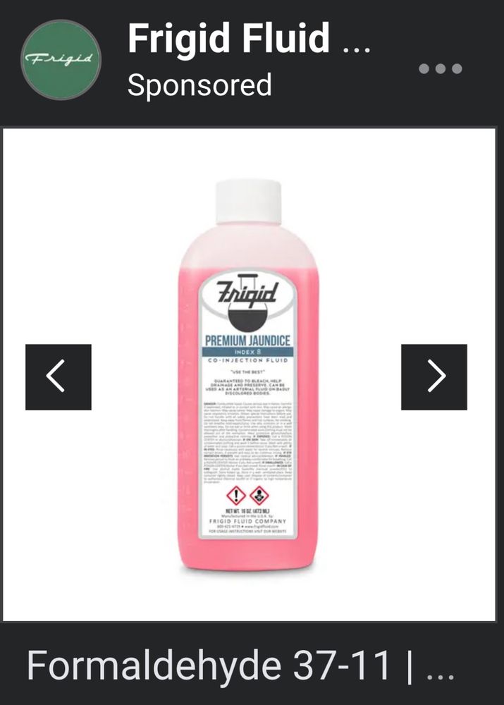 Plastic pint bottle like for juice filled with pink liquid. Says “premium jaundice”